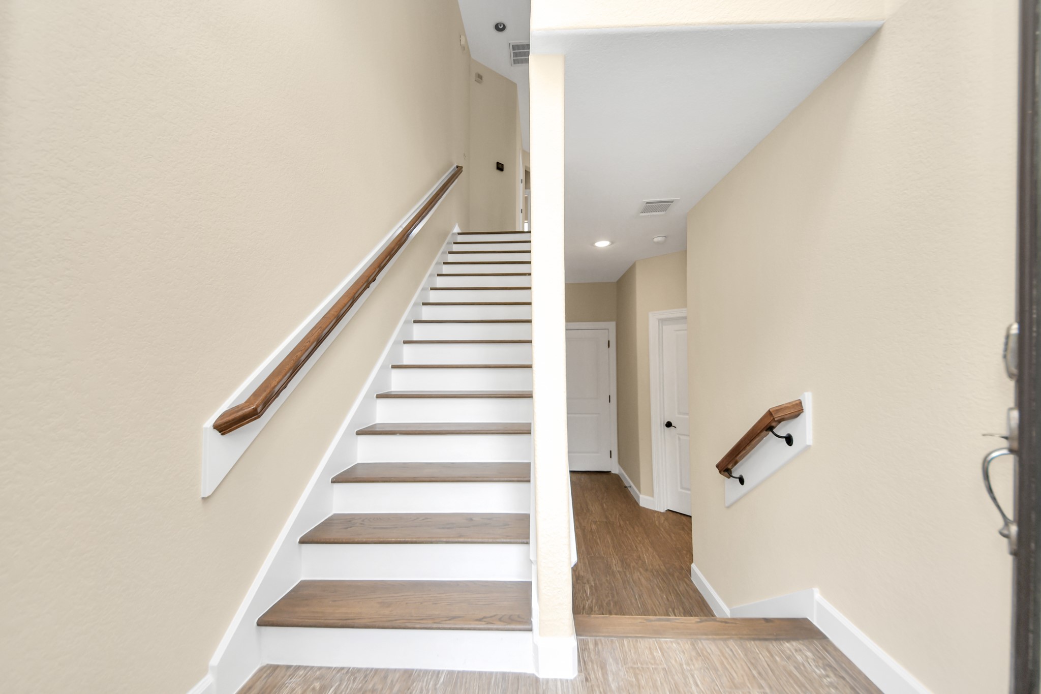 2830 Polk Street Houston, TX 77003 - Photo 7 of 21 Follow the staircase upward to the bright and inviting main living level, where the heart of the home unfolds.
