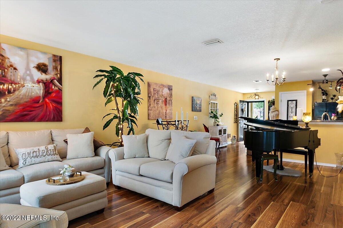 658 Cabernet Place St. Augustine, FL 32084 - Photo 4 of 11 a living room with furniture and wooden floor
