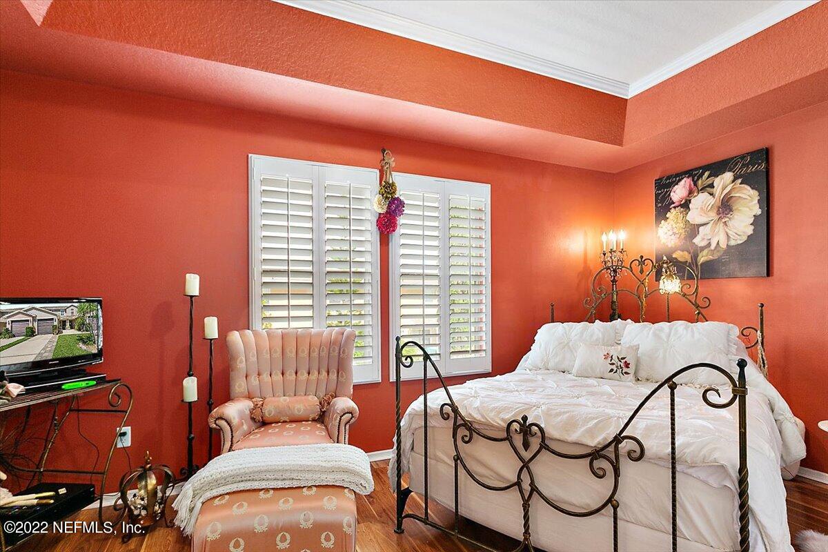 658 Cabernet Place St. Augustine, FL 32084 - Photo 7 of 11 a bedroom with a bed and a window