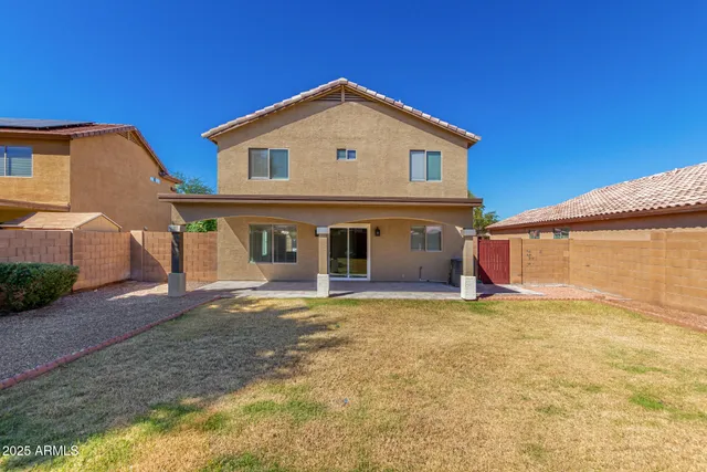 a view of a house with yard and a garage