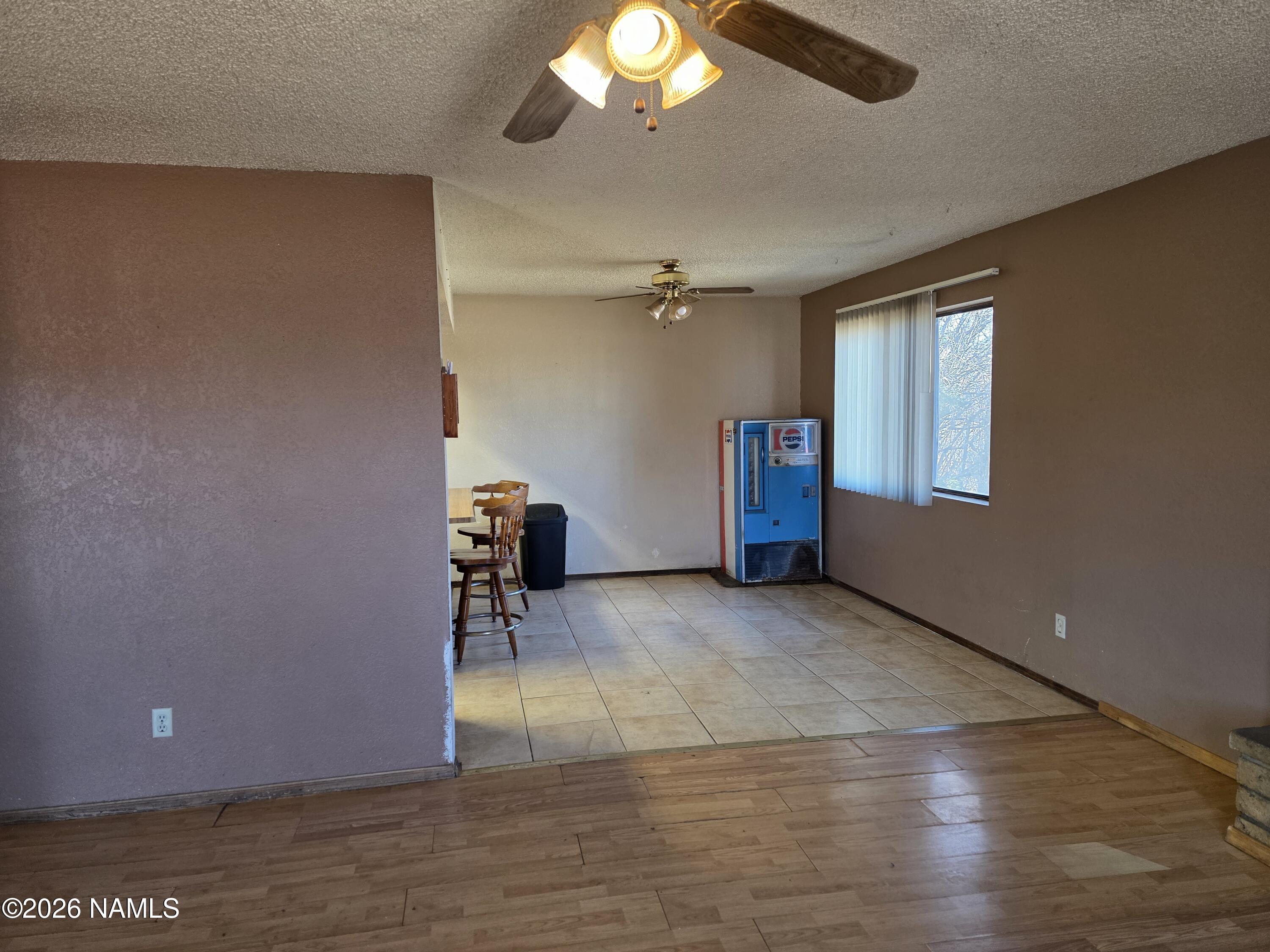218 East Edison Avenue Williams, AZ 86046 - Photo 20 of 29 wooden floor in an empty room with a window