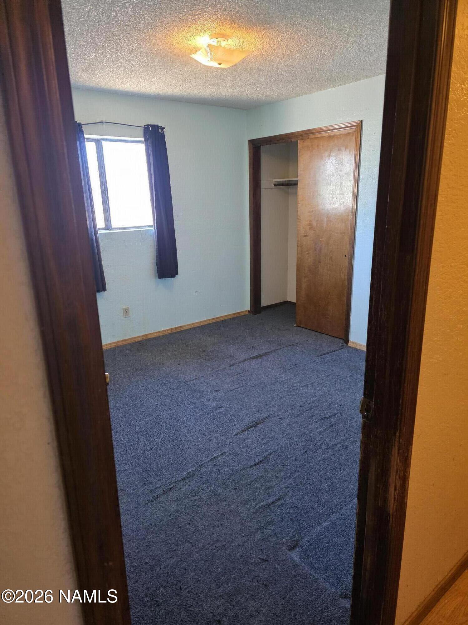 218 East Edison Avenue Williams, AZ 86046 - Photo 23 of 29 an empty room with windows