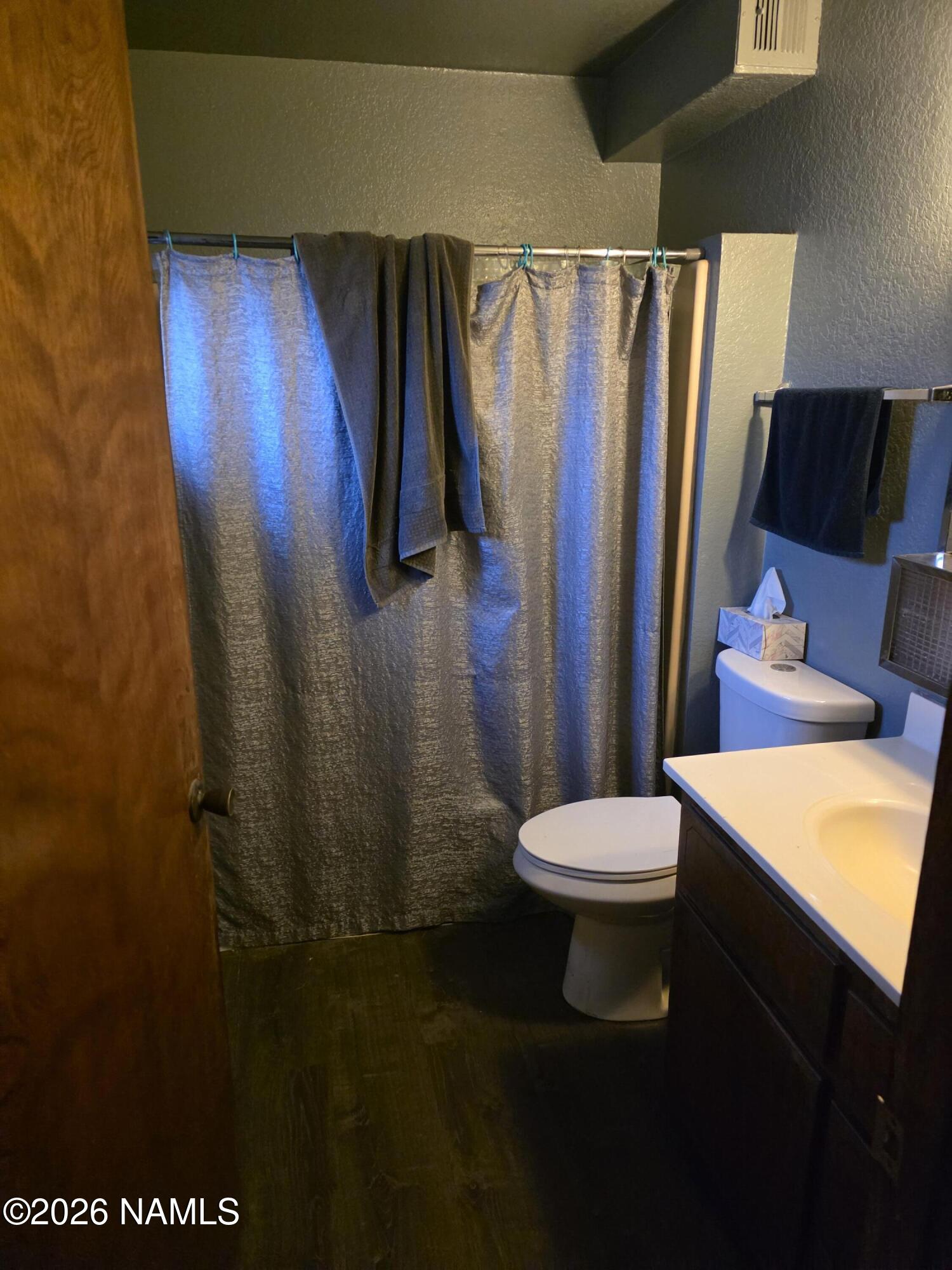 218 East Edison Avenue Williams, AZ 86046 - Photo 25 of 29 a bathroom with a sink a toilet and a shower