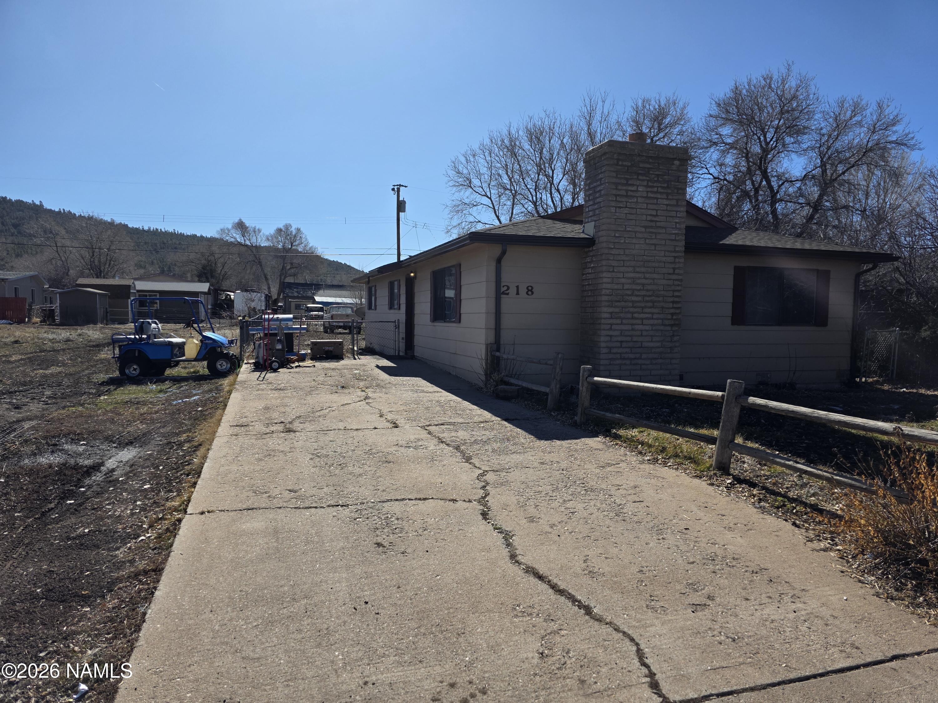 218 East Edison Avenue Williams, AZ 86046 - Photo 3 of 29 a backyard of a house with table and chairs