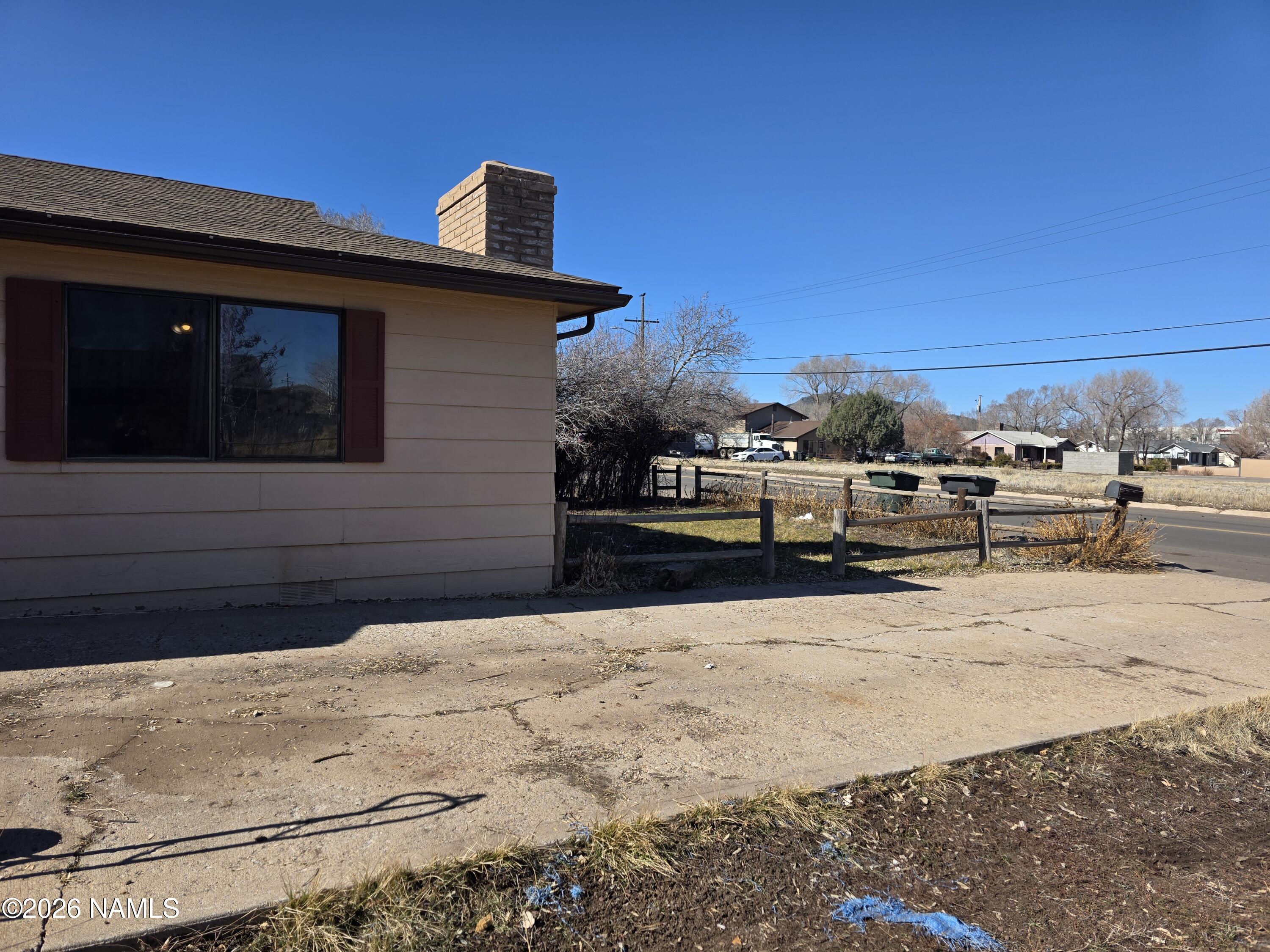 218 East Edison Avenue Williams, AZ 86046 - Photo 7 of 29 a front view of a house with a yard