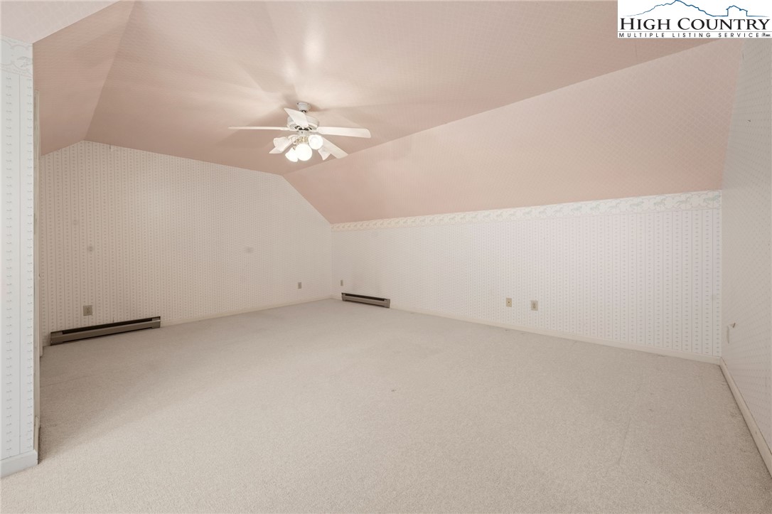 304 Glendale Drive Boone, NC 28607 - Photo 42 of 50 an empty room with chandelier fan and ceiling fan