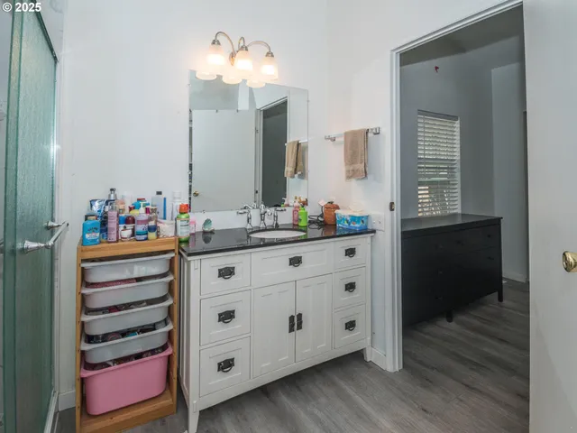 a bathroom with a double vanity sink and a mirror