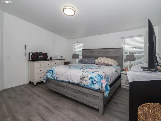 a bedroom with a bed and a couch