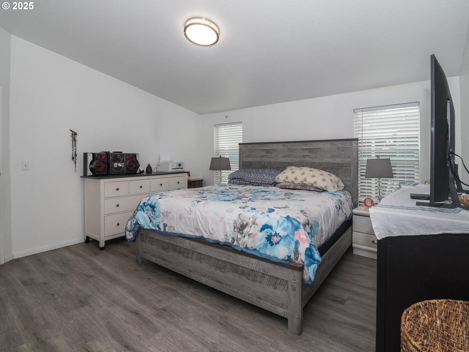 5200 Southeast 132nd Avenue, Unit 12 Portland, OR 97236 - Photo 16 of 17 a bedroom with a bed and a couch