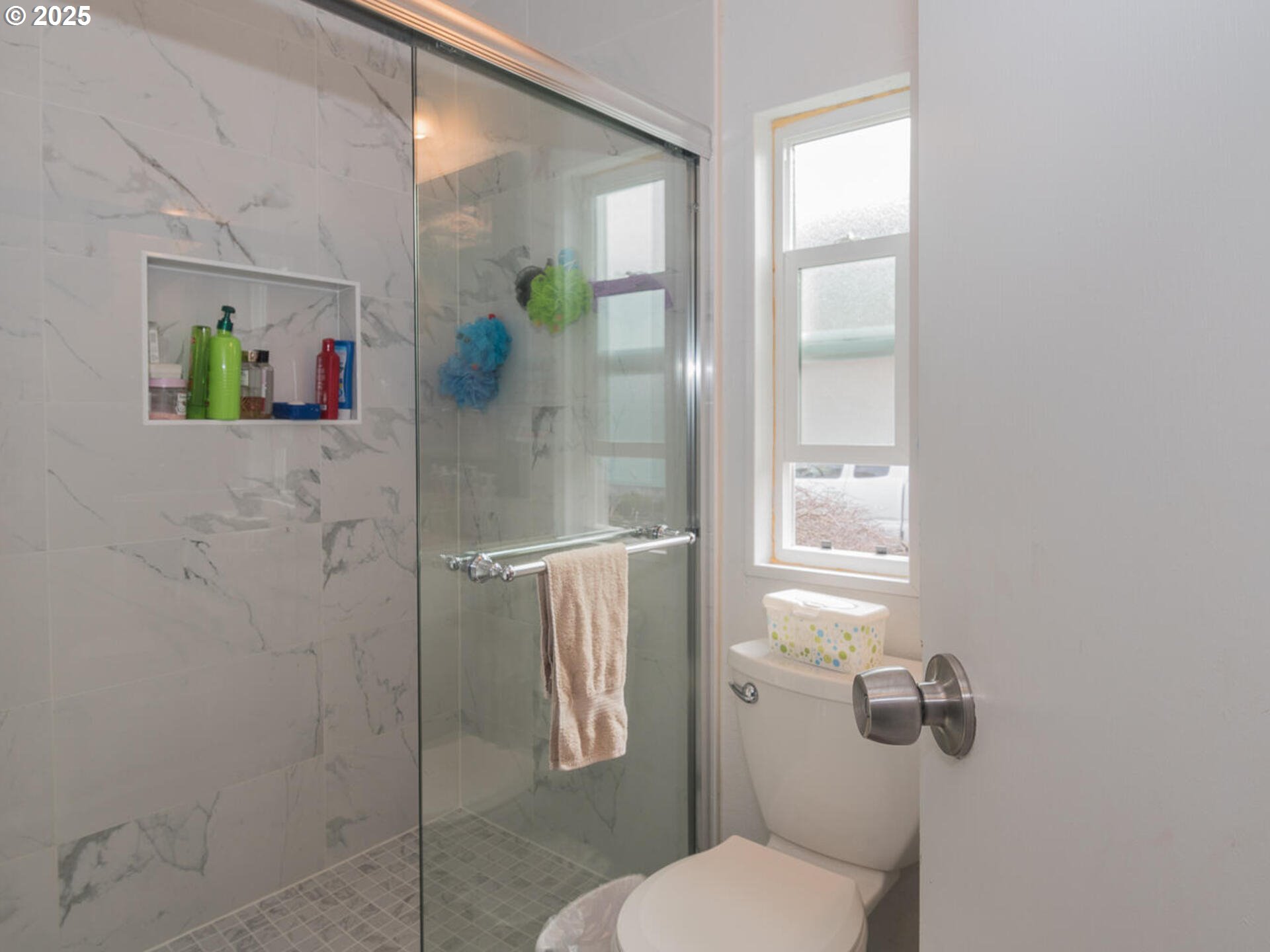 5200 Southeast 132nd Avenue, Unit 12 Portland, OR 97236 - Photo 17 of 17 a white toilet sitting next to a bathroom sink