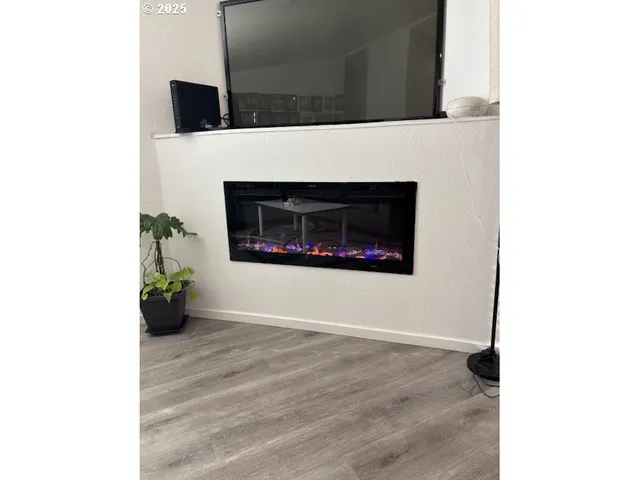 a living room with a fireplace