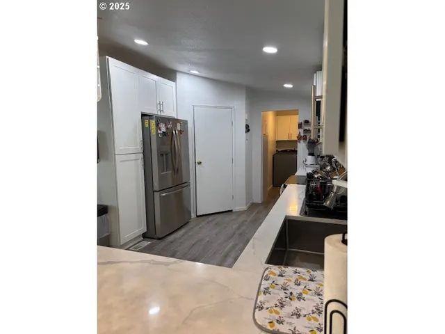 a living room with furniture and a rug