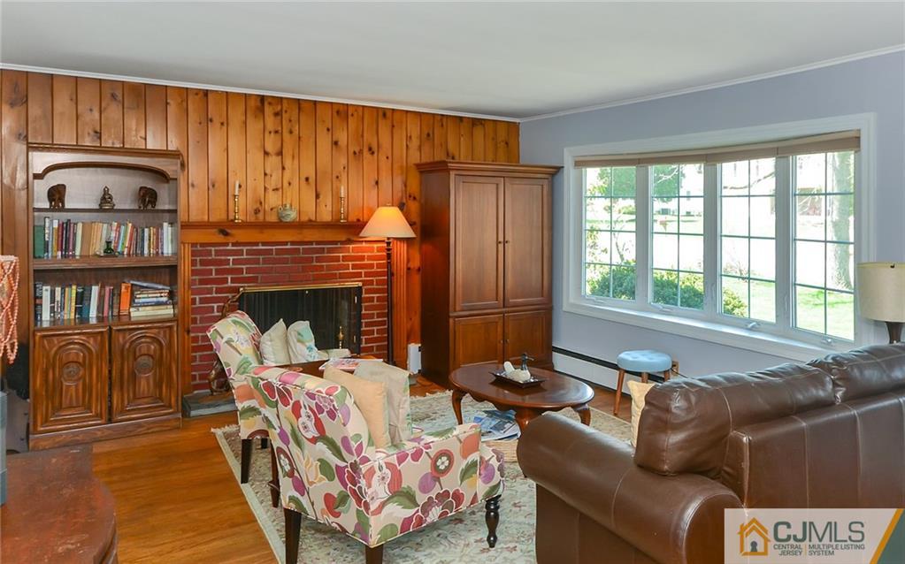 36 Harmony Road Randolph, NJ 07869 - Photo 2 of 22 a living room with furniture a window and a fireplace