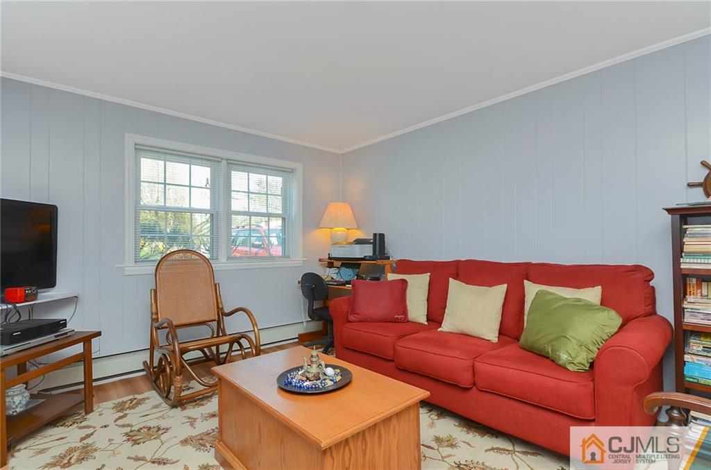 36 Harmony Road Randolph, NJ 07869 - Photo 14 of 22 a living room with furniture a flat screen tv and a window