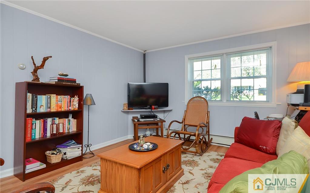 36 Harmony Road Randolph, NJ 07869 - Photo 15 of 22 a living room with furniture a window and a flat screen tv