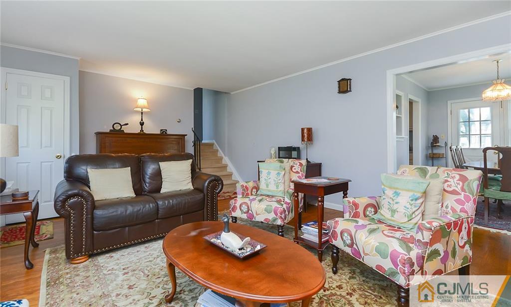 36 Harmony Road Randolph, NJ 07869 - Photo 5 of 22 a living room with furniture and a wooden floor
