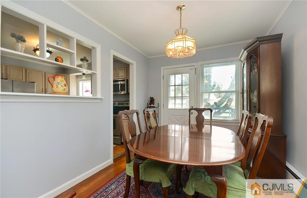 36 Harmony Road Randolph, NJ 07869 - Photo 6 of 22 a view of a dining room with furniture a chandelier and wooden floor
