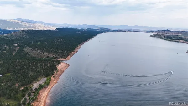 an aerial view of mountain with yard