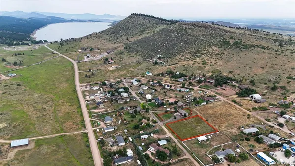 an aerial view of mountain with ocean