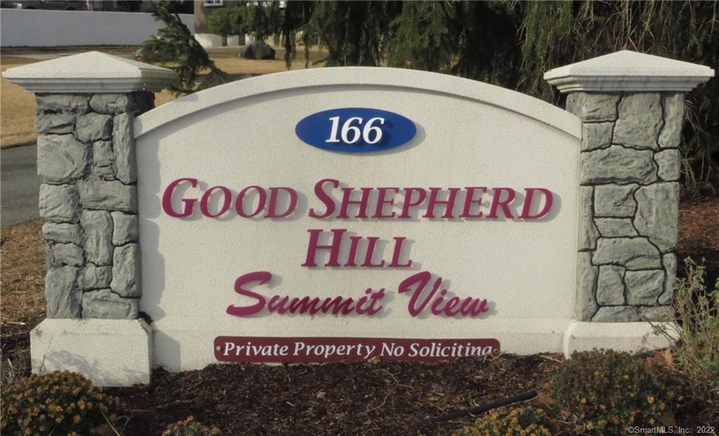 166 Old Brookfield Road, Unit 293 Danbury, CT 06811 - Photo 1 of 1 a sign that is on a wall
