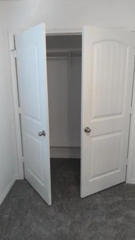an empty room with closet