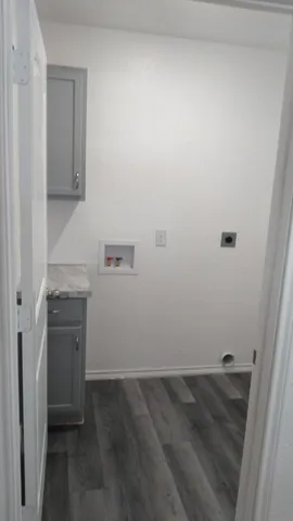 a view of a storage and utility room with a sink