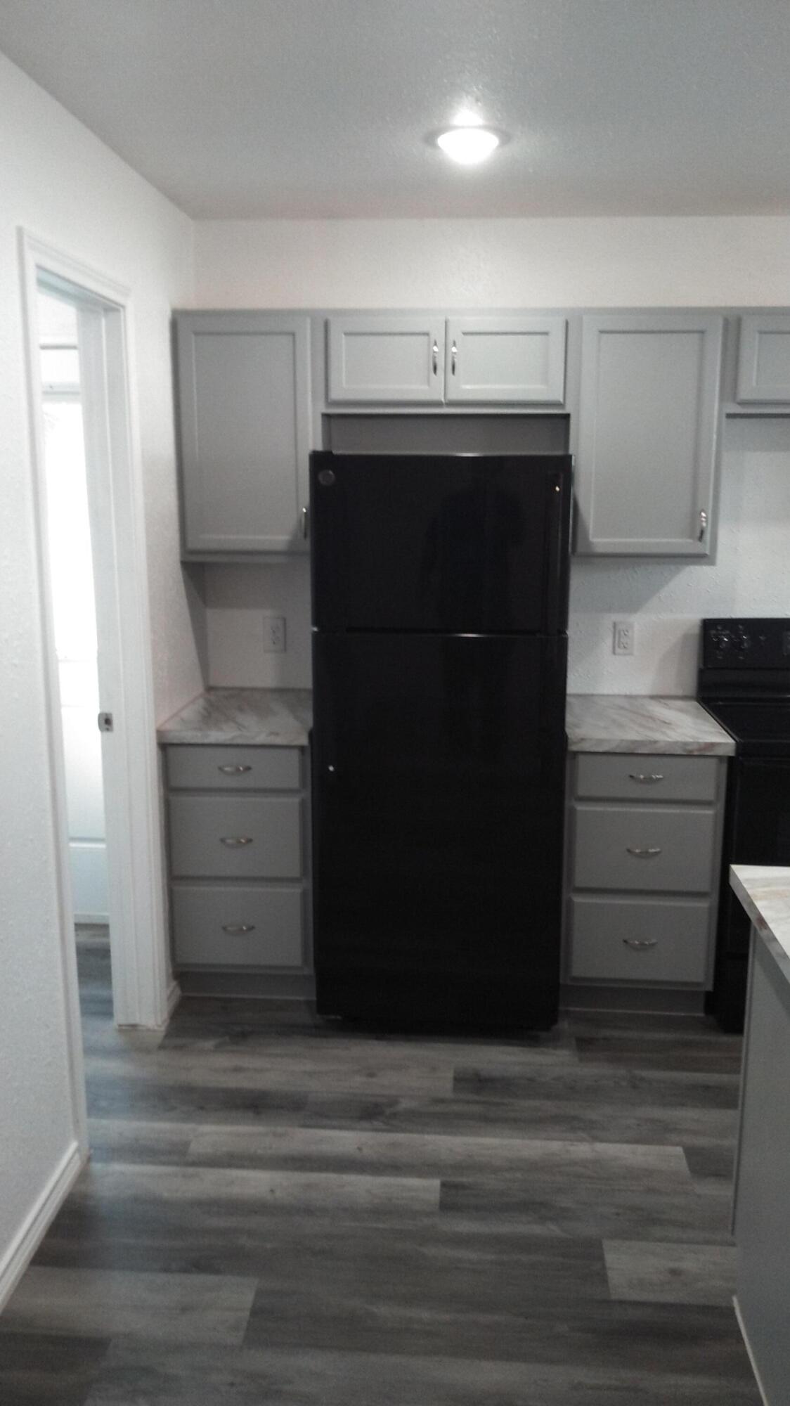 1101 14th Street Abernathy, TX 79311 - Photo 5 of 19 a bathroom with a sink and a mirror