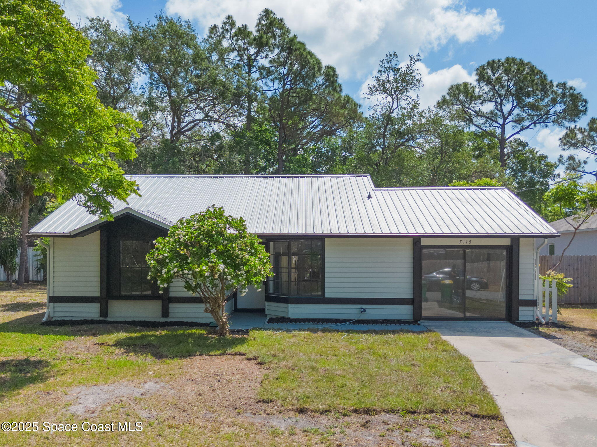 swimming pool view with a seating space