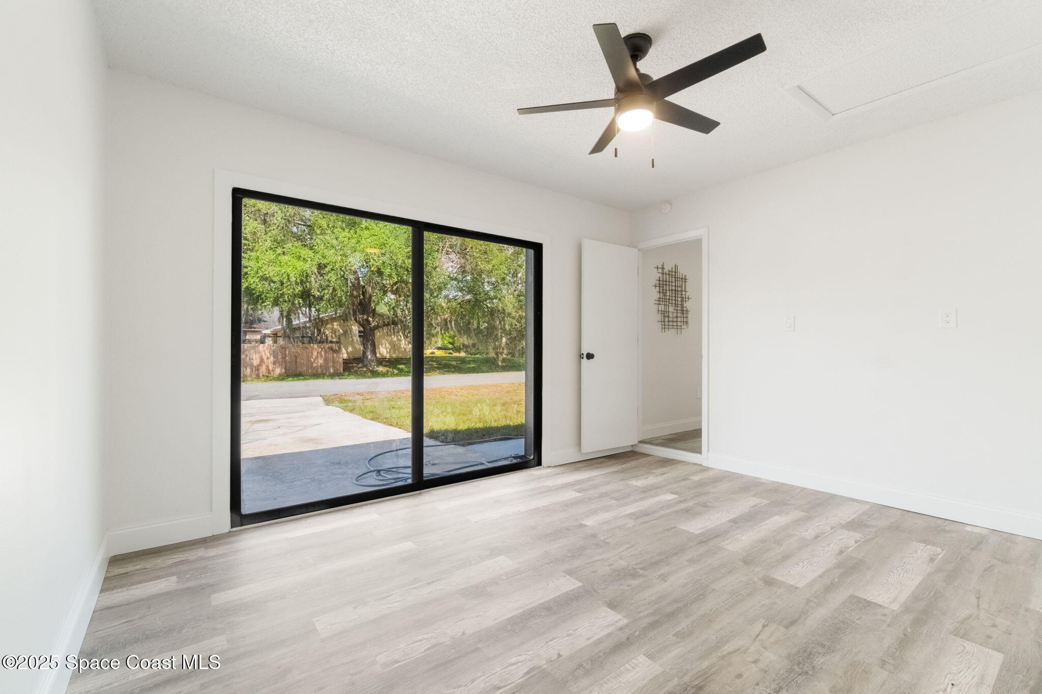 7115 Camilo Road Cocoa, FL 32927 - Photo 16 of 25 a view of an empty room with a window