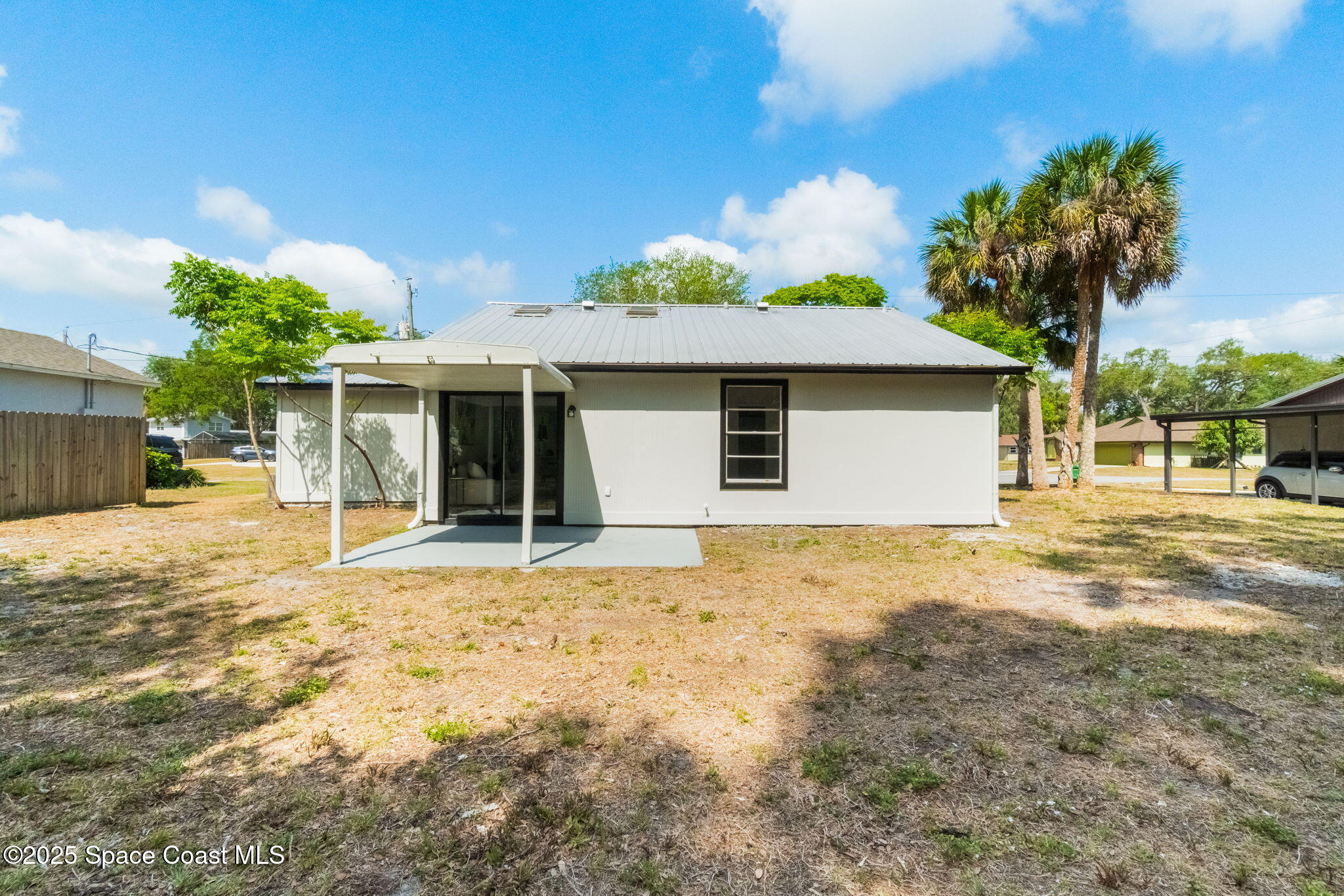 7115 Camilo Road Cocoa, FL 32927 - Photo 21 of 25 a house with trees in front of it
