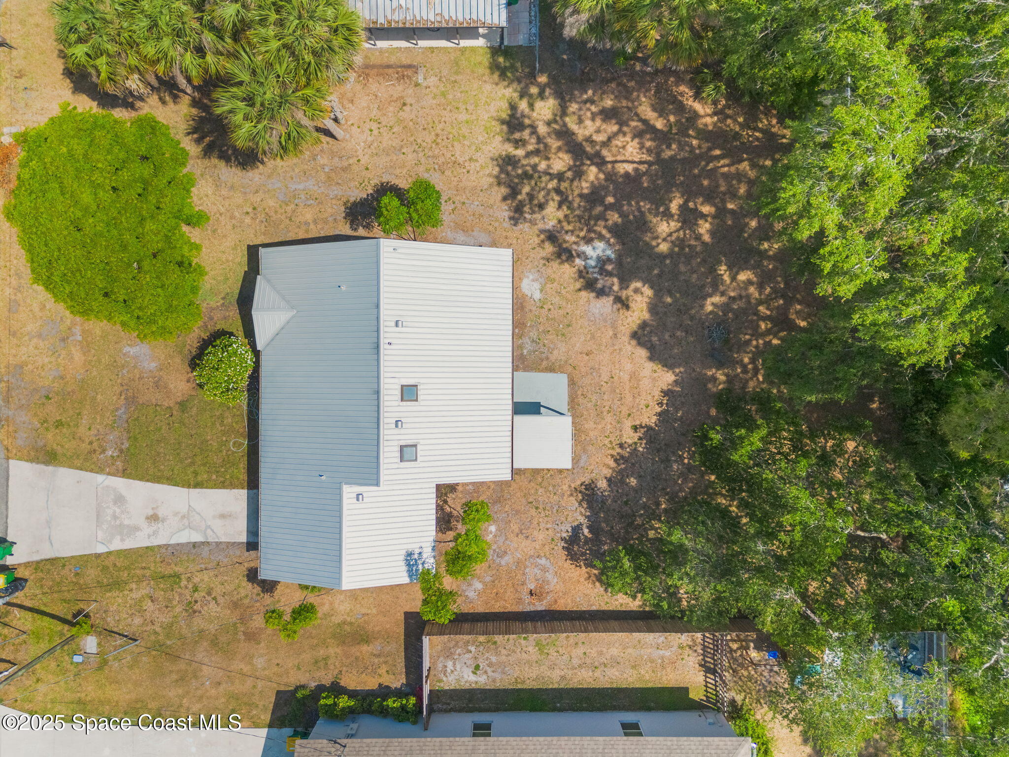 7115 Camilo Road Cocoa, FL 32927 - Photo 25 of 25 front view of a house with a trees
