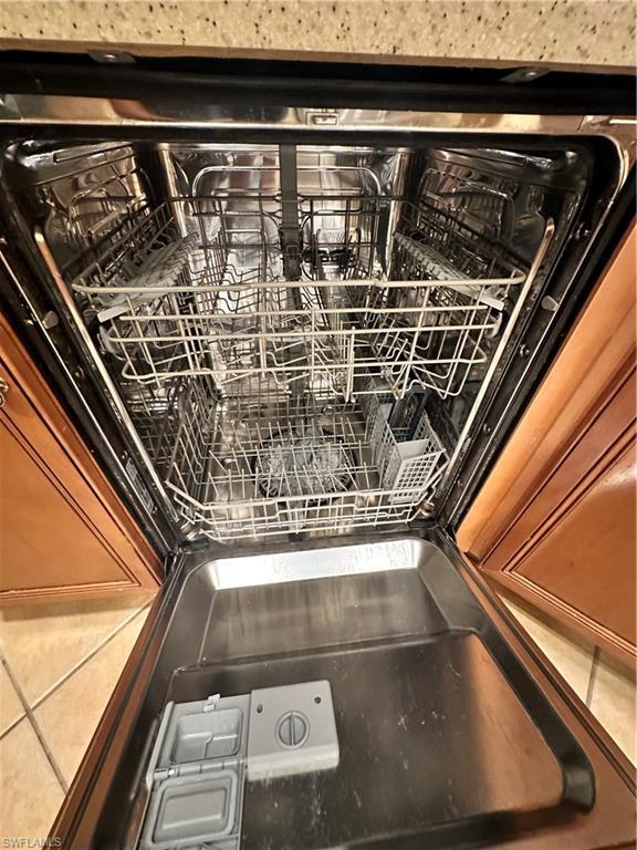8267 Laurel Lakes Way Naples, FL 34119 - Photo 12 of 23 Kitchen view of dishwashing machine