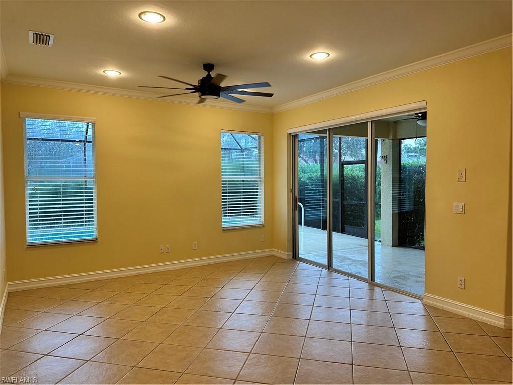 8267 Laurel Lakes Way Naples, FL 34119 - Photo 14 of 23 Spare room featuring crown molding, ceiling fan, light tile patterned flooring, healthy amount of natural light, and recessed lighting