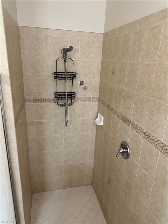 8267 Laurel Lakes Way Naples, FL 34119 - Photo 15 of 23 Bathroom with a tile shower