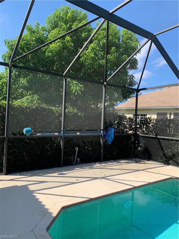 8267 Laurel Lakes Way Naples, FL 34119 - Photo 21 of 23 Swimming pool featuring a lanai and a sunroom