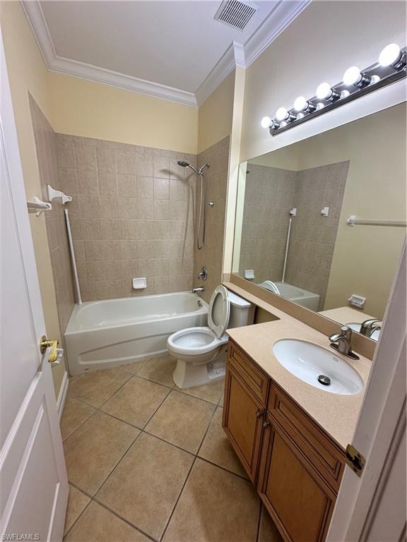 8267 Laurel Lakes Way Naples, FL 34119 - Photo 5 of 23 Bathroom with tub / shower combination, vanity, ornamental molding, and light tile patterned floors