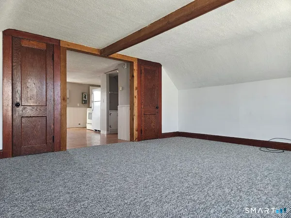a view of a room with a hallway