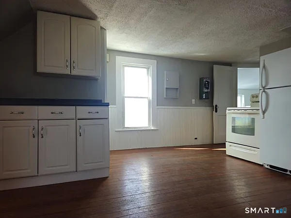 a view of cabinets with wooden floor and cabinets