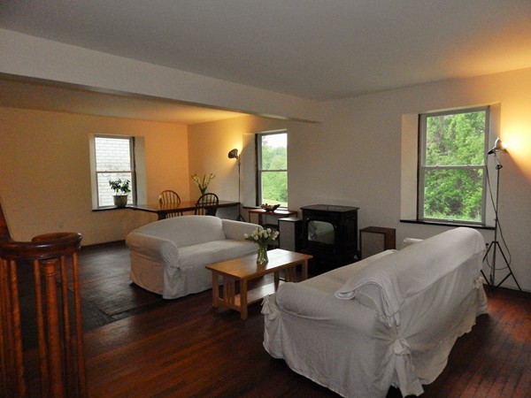 339 Amherst Road Pelham, MA 01002 - Photo 15 of 24 a living room with furniture and a large window