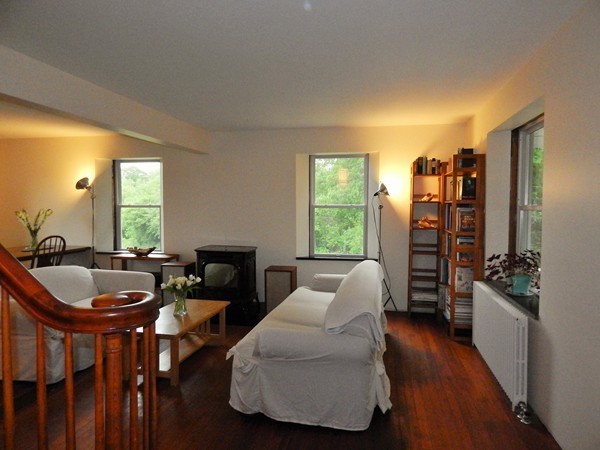 339 Amherst Road Pelham, MA 01002 - Photo 16 of 24 a living room with furniture and a wooden floor