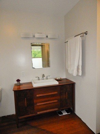 339 Amherst Road Pelham, MA 01002 - Photo 20 of 24 a room with a mirror and a wooden floor