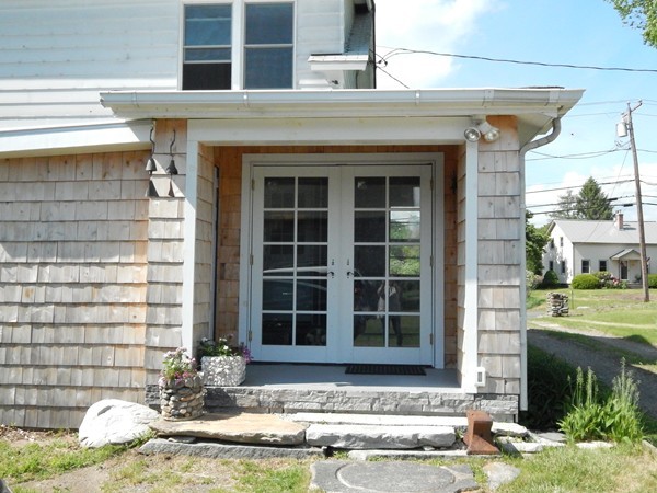 339 Amherst Road Pelham, MA 01002 - Photo 6 of 24 a front view of a house with a yard