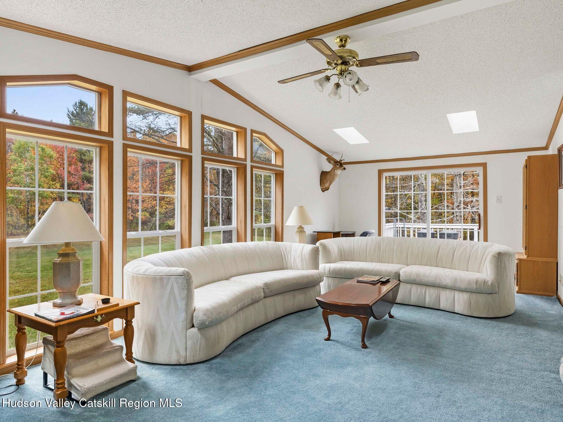 370 Begley Road Windham, NY 12496 - Photo 15 of 51 a living room with furniture and a large window