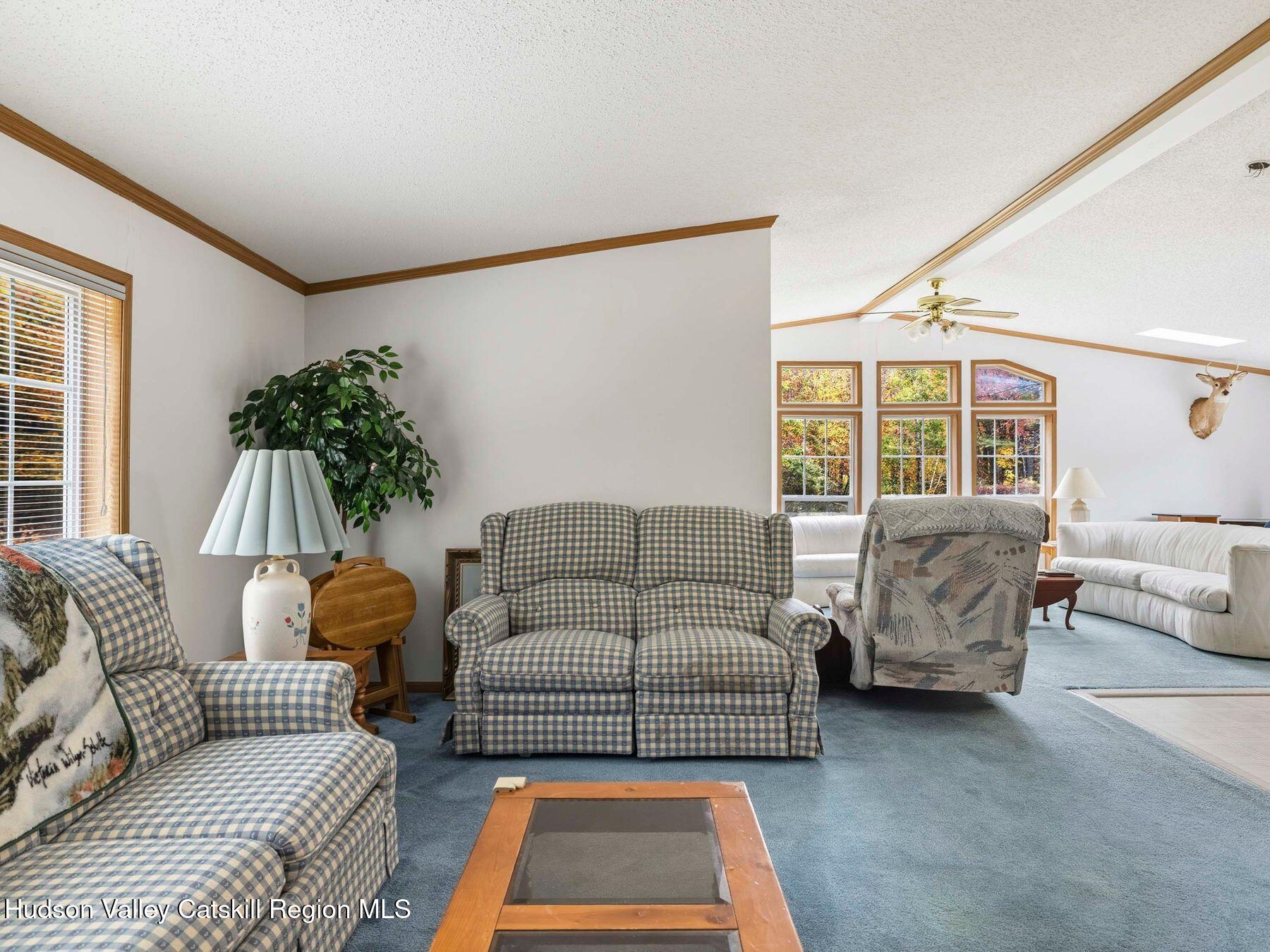 370 Begley Road Windham, NY 12496 - Photo 18 of 51 a living room with furniture and a couch