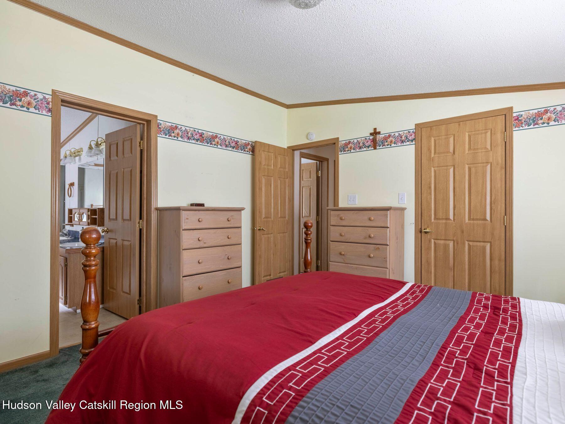 370 Begley Road Windham, NY 12496 - Photo 28 of 51 a bedroom with a bed and a dresser