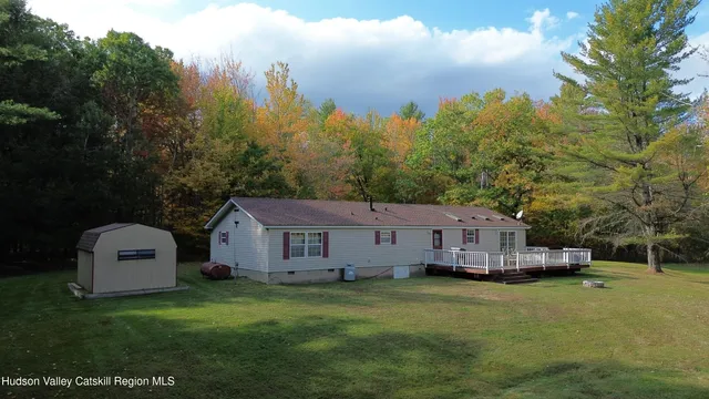 a view of house with backyard and entertaining space