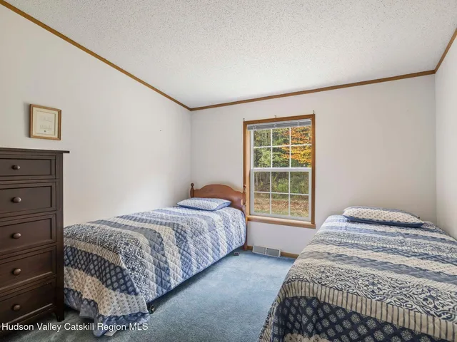 a bathroom with a sink a mirror and a shower