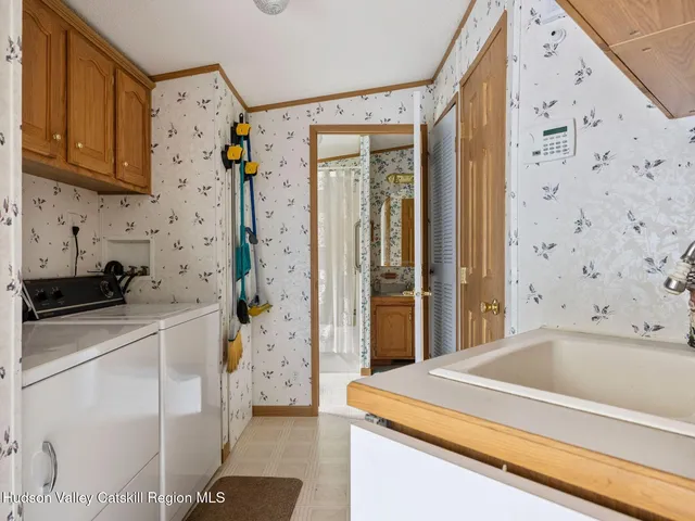 a kitchen with a refrigerator and cabinets