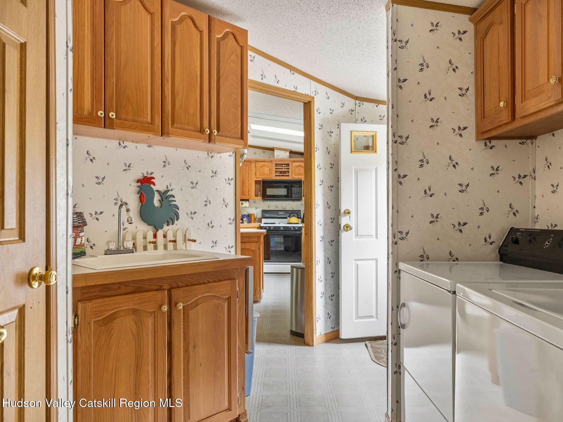 370 Begley Road Windham, NY 12496 - Photo 38 of 51 a kitchen with a refrigerator and cabinets