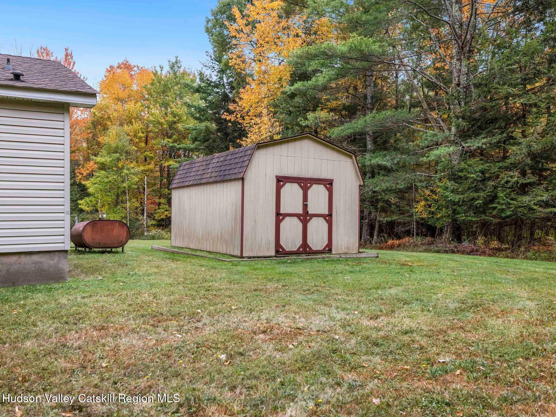 370 Begley Road Windham, NY 12496 - Photo 41 of 51 a house view with garden space and trees